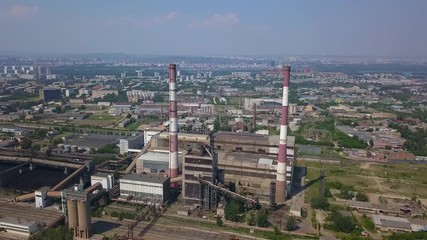Drone shot of the factory with the Krasnoyarsk city on the background