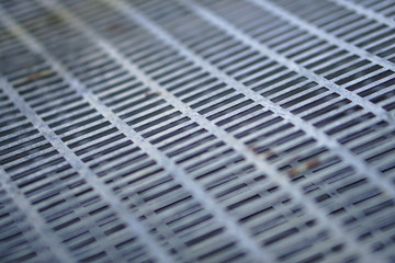 Metal cage texture with different layers. Steel sheet for background. Stock photo.