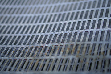 Metal cage texture with different layers. Steel sheet for background. Stock photo.