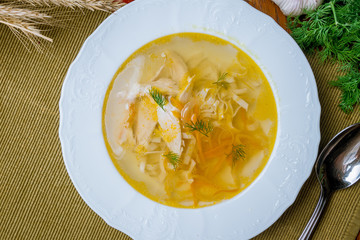 Chicken soup bouillon in a plate