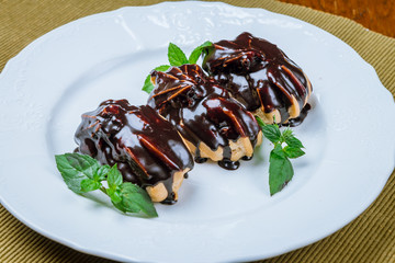 Chocolate Eclairs on a plate