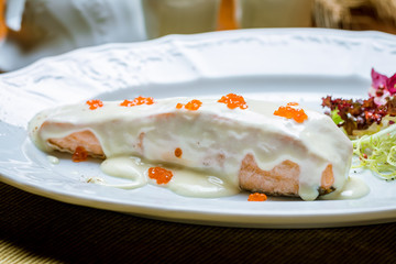 salmon in a creamy caviar sauce