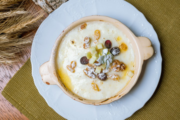 Semolina porridge with fruits and nuts