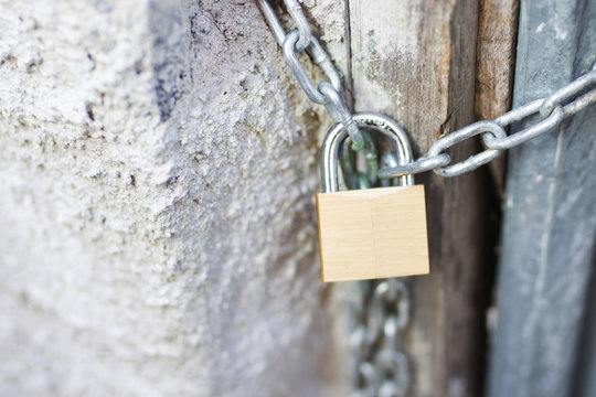 Security Padlock With Chain On The Door Vintage