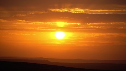 sunset in the desert orange sky