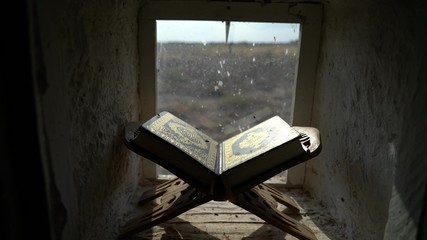 Ancient Koran on a Prayer Table