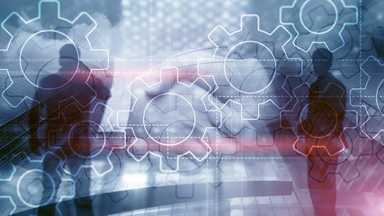 Double exposure gears mechanism on blurred background. Business and industrial process automation concept.