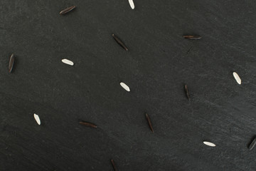 Raw Black Wild Rice on Dark Stone Background
