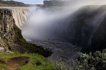 Dettifoss Waterfall feeding powerful river, Iceland