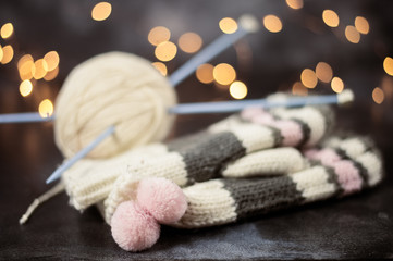 Obraz na płótnie Canvas Winter Christmas knitting. Warm wool mittens festive backg
