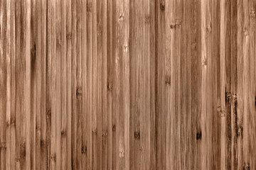 Texture veneer made from stained wood. Decorative finishing with a narrow vertical board