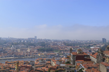 Obraz premium Scenic view of Porto, Portugal from the tower Clérigos Church. River Douro. Orange roofs of the houses.
