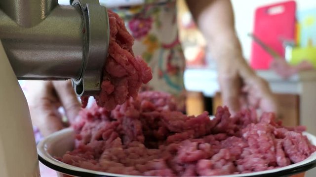 Meat Forcemeat Using The Meat Grinder In Kitchen