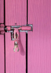 Lock and Door Handle on Pink Wooden Door