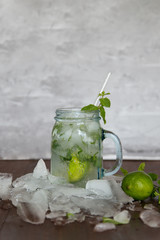 Mojito in a jar with ice and lime slices