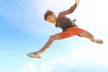 Young boy run and jump