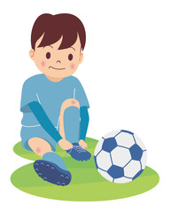 サッカー少年_スパイクを履く