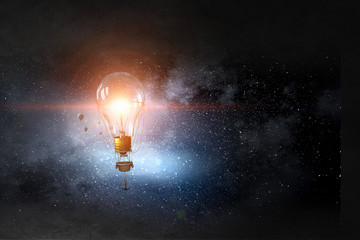 Glass bulb in dark sky. Mixed media