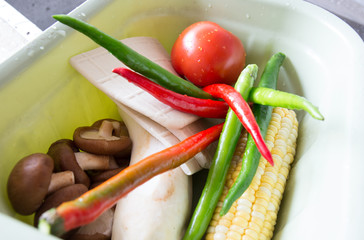 Clean vegetables and other ingredients are placed in the basket