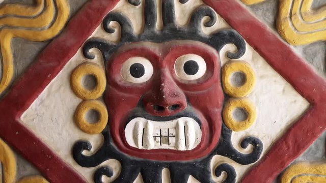 Adobe wall with a God of the Mochica culture, Peru