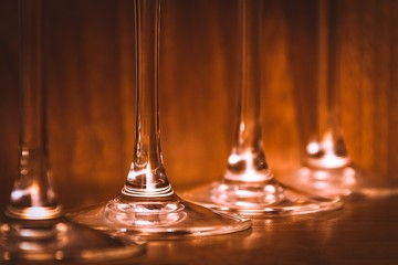 Catering, party concept: close-up image of wine glasses on a dark wooden background. Selective focus.