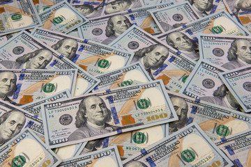 One hundred dollar bills as a wallpaper.