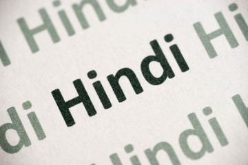 word Hindi  language printed on paper macro