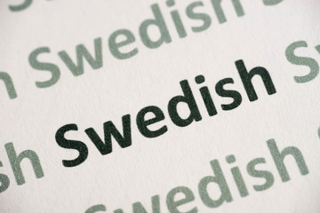word Swedish language printed on paper macro
