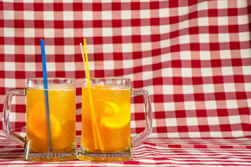 Beer with lemon in glass glasses close-up.