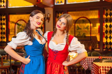 Young beautiful waitress girls at Oktoberfest.
