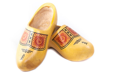 Wooden shoes typical for traditional rural wear in The Netherlands shot in the studio on a white background