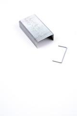Metal staples on white background