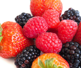 Fresh strawberry, raspberry and blackberry on wooden background, healthy food and diet.