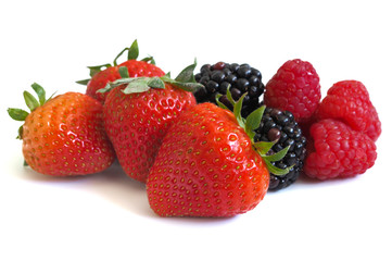 Fresh strawberry, raspberry and blackberry on wooden background, healthy food and diet.