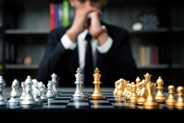 Business people are deciding on trade investments. Chess Gold is a marketing strategy that targets...