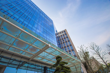 Fototapeta na wymiar Modern corporate office building, huge glass window wall