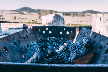 Wood Fire Pit with burnt wood in the country Mudgee