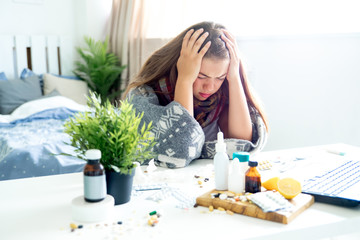 ill young girl with fever spending time at home