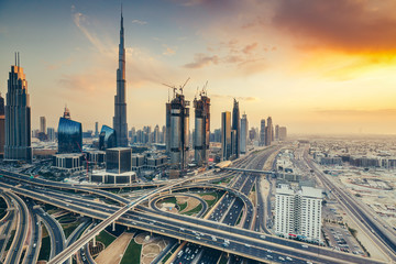 Fototapeta premium Scenic view on downtown Dubai, United Arab Emirates at sunset. Colourful travel background.