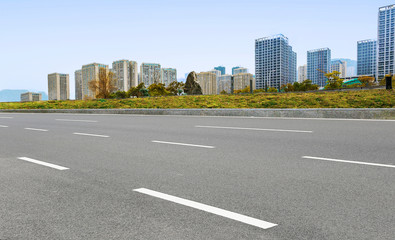 Modern city and asphalt highway