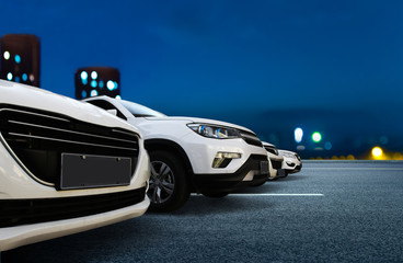 Several cars are neatly parked on the floor of the city square