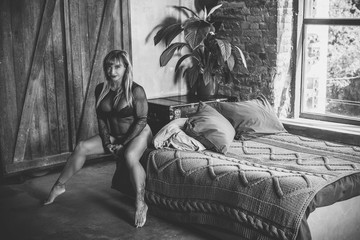 Hot sexy mature fit athletic woman demonstrates her body. Concept of sport, bodybuilding and women...