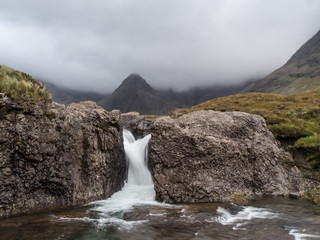 2-way waterfall from rocks in mountains
