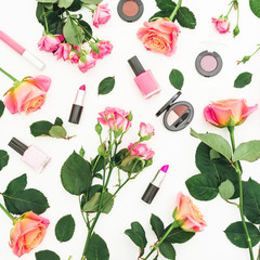Obraz na płótnie Canvas Floral pattern of roses flowers and feminine make up cosmetics on white background. Flat lay, top view.