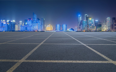 Urban road asphalt pavement and skyline of Hangzhou architectural landscape