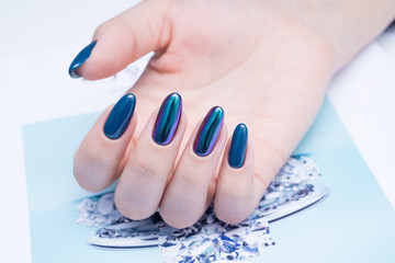 Attractive manicure on women's hands. Natural finger nails with stylish nail art.
