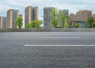 Modern city high-rise and asphalt highway