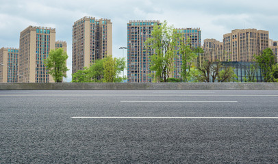 Modern city high-rise and asphalt highway