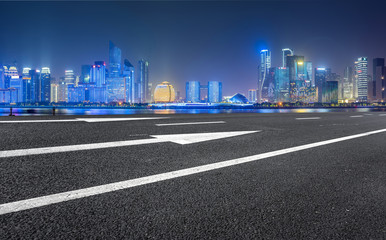 Urban road asphalt pavement and skyline of Hangzhou architectural landscape