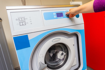 Woman doing laundry - washing machine